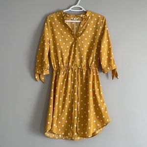 Polka dotted gold colored dress